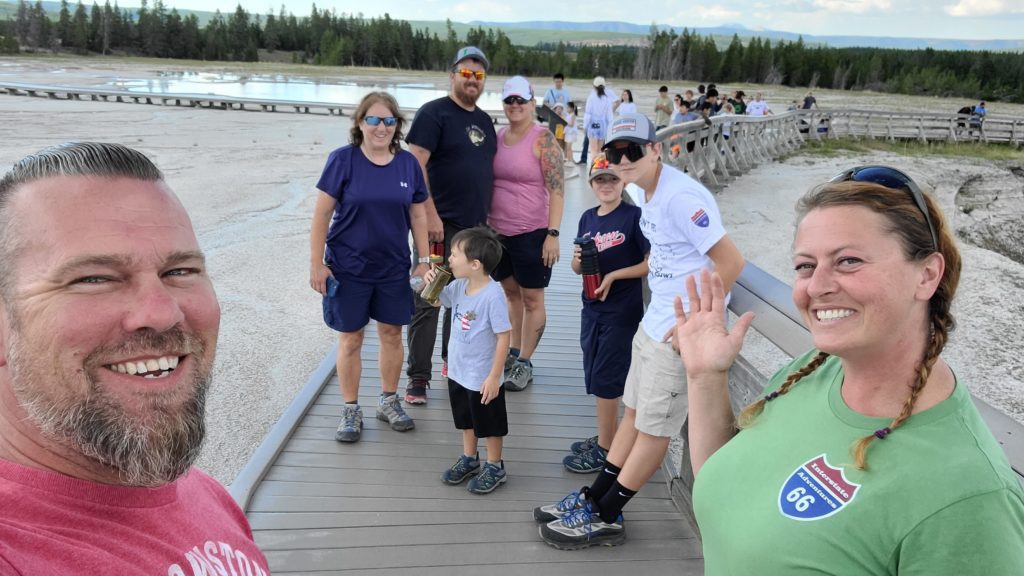 Most of the Ryan family and us hiking around the Grand Prismatic loop in Yellowstone National Park.